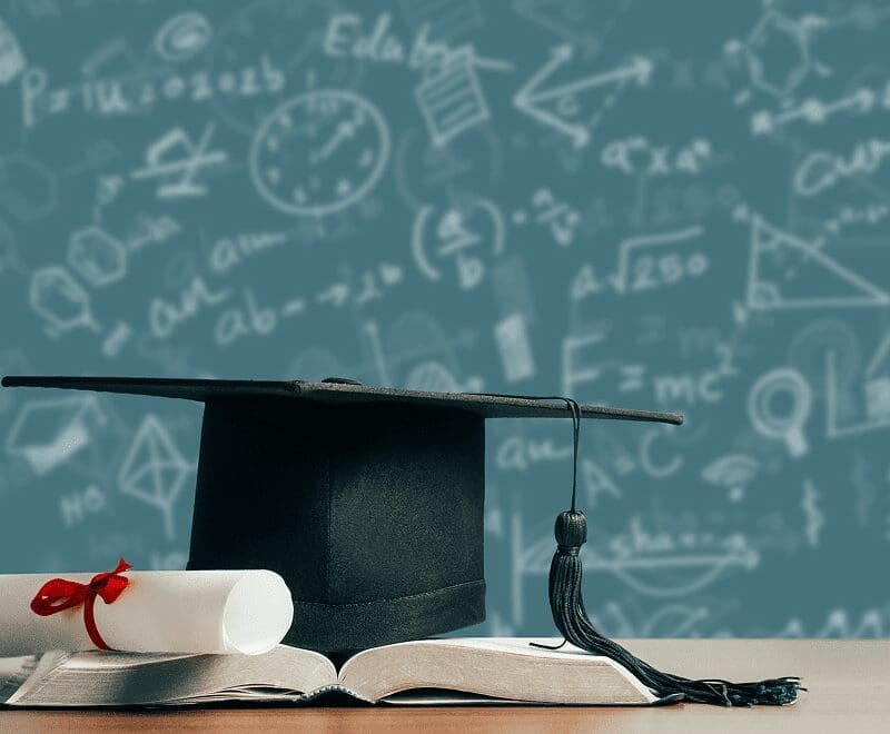 Academic symbols and chalkboard background